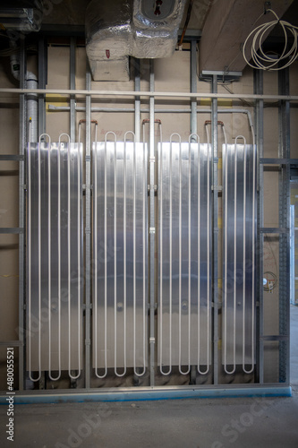 a wall heating system is installed in a new operating theater building