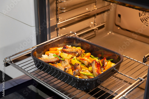 Roasted pork cooked in oven with vegetables