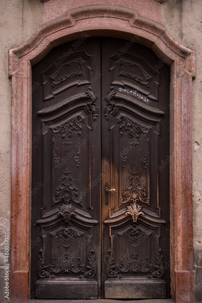 Munich, Germany - December 20 2021: Old Decorative Main Entrance Wooden Door.