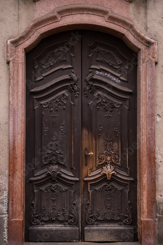 Munich, Germany - December 20 2021: Old Decorative Main Entrance Wooden Door. © A1