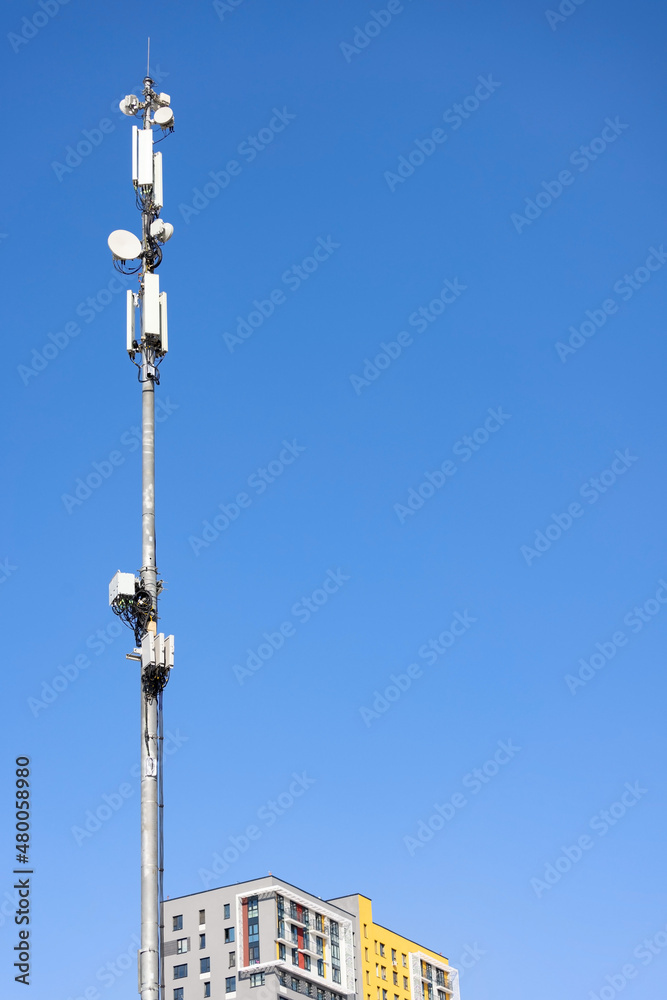Telecommunication cellular tower pole on the blue sky Telecommunication cellular tower pole on the blue sky