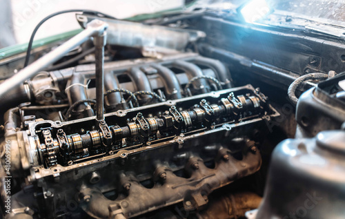 car engine repair, camshaft valve adjustment. © velimir