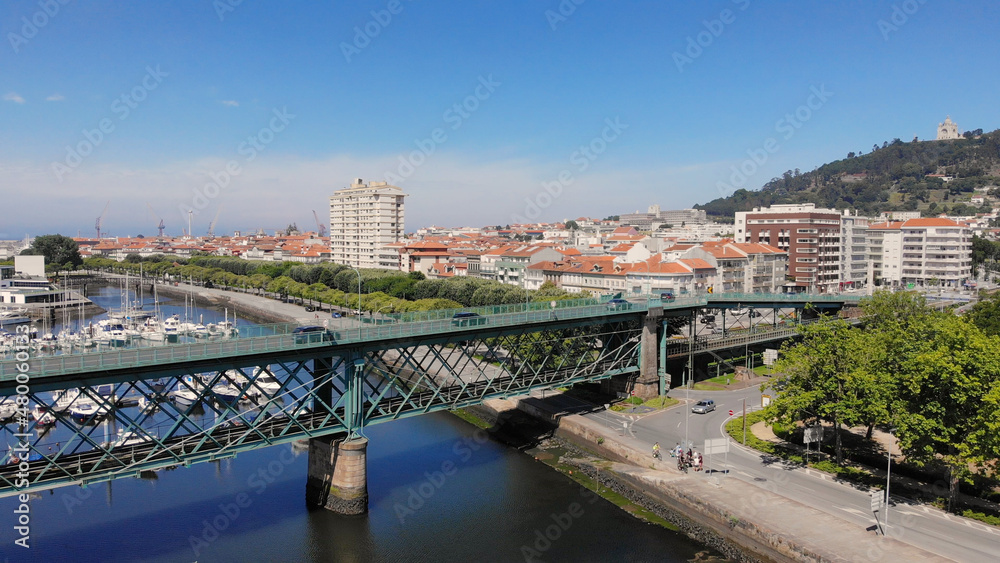 The Gustave Eiffel Bridge over the river Lima in Viana do Castelo. Aerial panoramic cityscape view of Viana and the Marina.