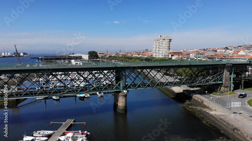The Gustave Eiffel Bridge over the river Lima in Viana do Castelo. Aerial panoramic cityscape view of Viana and the Marina.