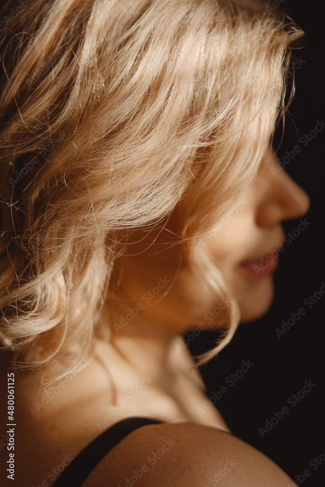 Older beautiful blond woman in the rays of the sun. High quality photo Older beautiful blond woman in the rays of the sun. High quality photo