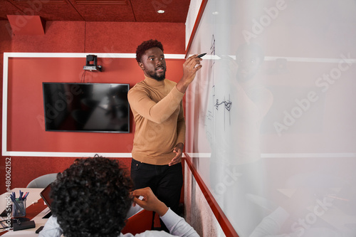 Future bloggers discussing new methodic while standing at the modern classroom