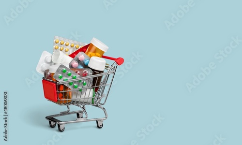 Fotografie, Obraz A supermarket trolley full of blister pills, home delivery of medicines