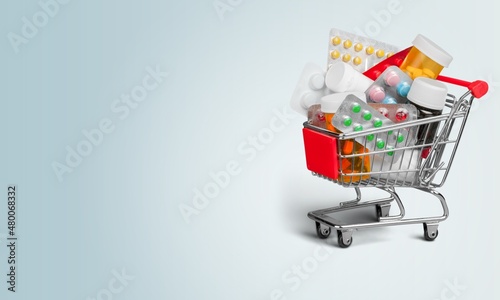 A supermarket trolley full of blister pills, home delivery of medicines.