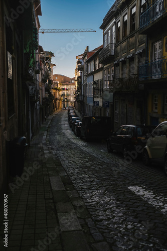 A view of the one of the narrow streets in the old town of Porto, Portugal. © De Visu