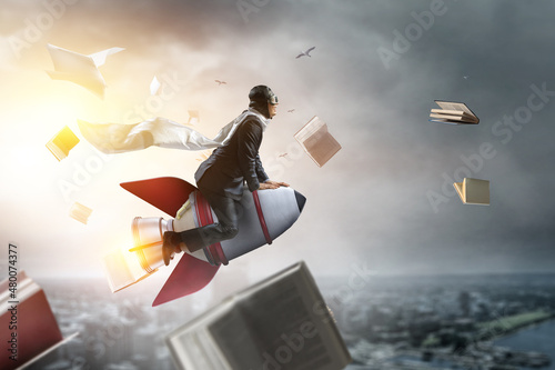фотографія Businessman on a rocket . Mixed media