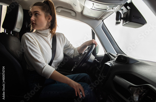 A girl driving a car © Dusan Kostic