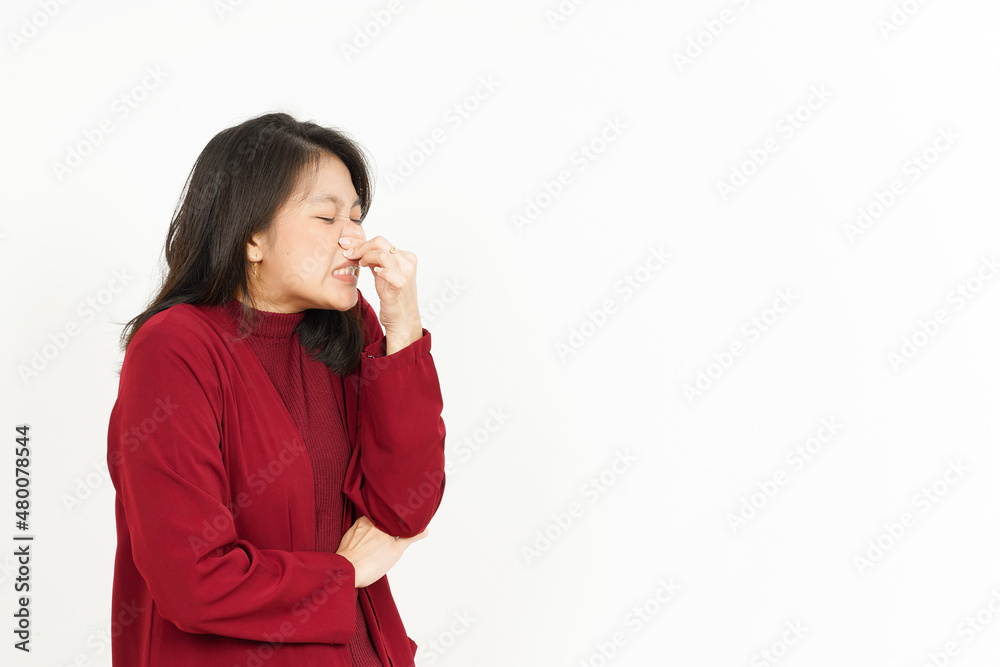 Smelling something stinky and disgusting Of Beautiful Asian Woman Wearing Red Shirt Smelling something stinky and disgusting Of Beautiful Asian Woman Wearing Red Shirt