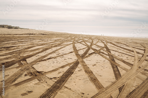 Tire tracks on sandy beach. Oceano Dunes, California, the only California State Park that allows  vehicles to drive on the beach