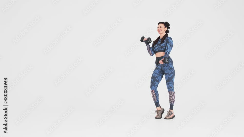 Sportswoman doing exercises with dumbbells on a white background, fitness trainer performs exercises on the buttocks and legs on an isolated white background
Sportswoman doing exercises with dumbbells on a white background, fitness trainer performs exercises on the buttocks and legs on an isolated white background