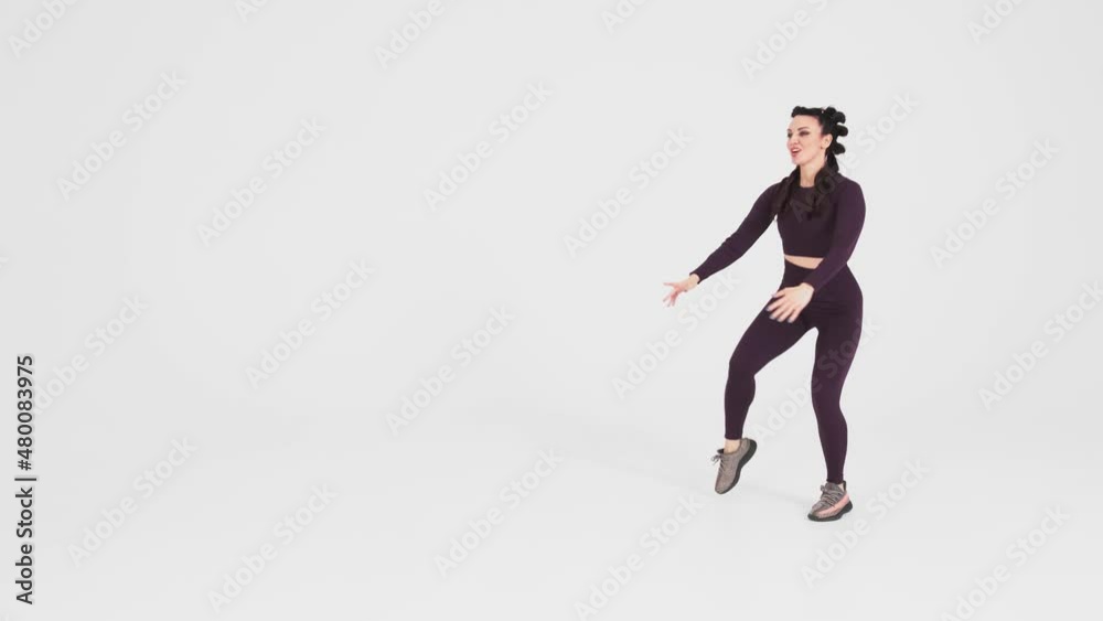 Professional sportswoman exercising over isolated white background. The woman squats and does abdominal exercises. Fitness and wellness concept
Professional sportswoman exercising over isolated white background. The woman squats and does abdominal exercises. Fitness and wellness concept