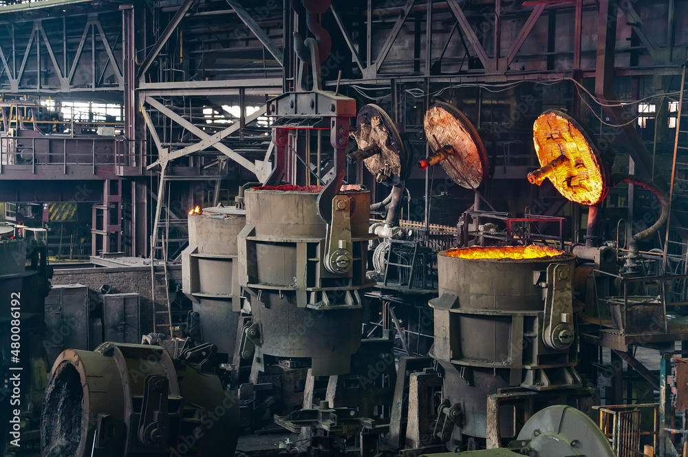 Fototapeta premium Metallurgical production. Melting of metal in an open-hearth furnace.