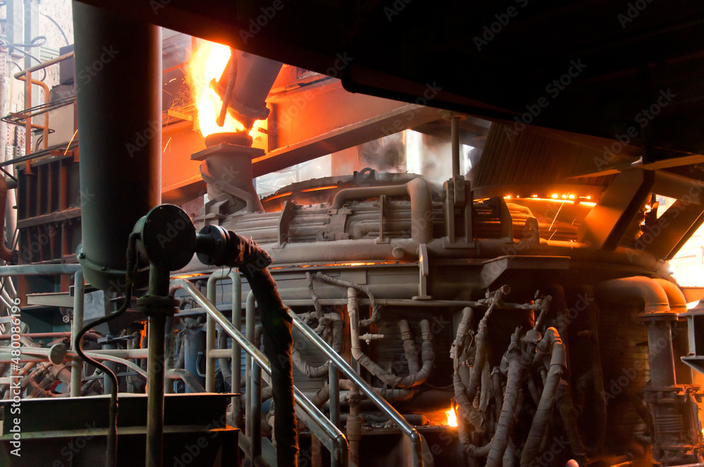 Metallurgical production. Red-hot metal in a vat.