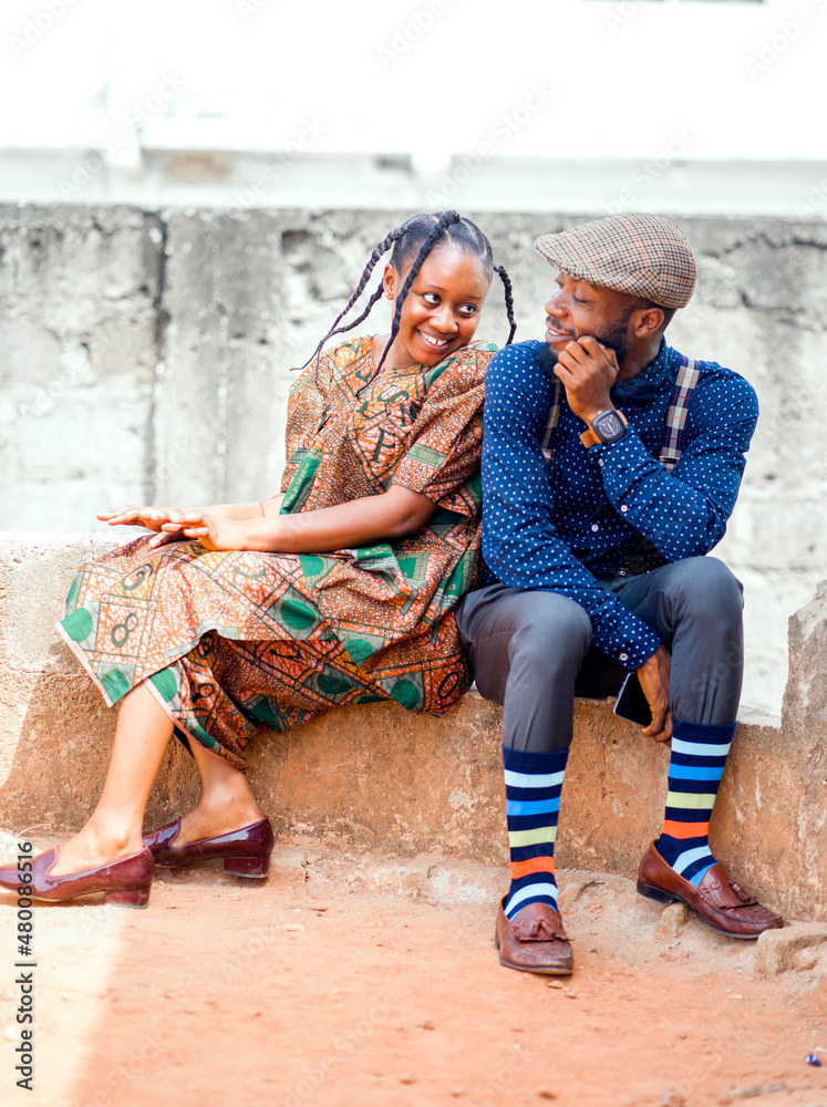 selective focus of african woman and a man outside, cheerful black people looking at each other selective focus of african woman and a man outside, cheerful black people looking at each other