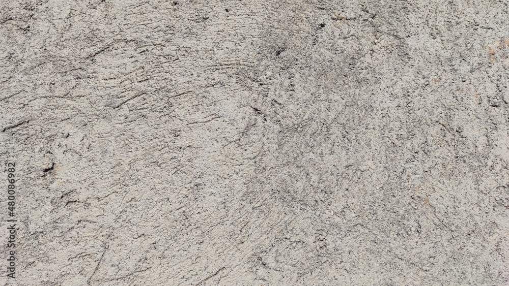 Abstract defocused background photo of a flat wall covered with cement Abstract defocused background photo of a flat wall covered with cement