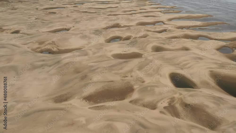 Beautiful sandy river bottom at low tide in northern Siberia on a sunny summer day Beautiful sandy river bottom at low tide in northern Siberia on a sunny summer day