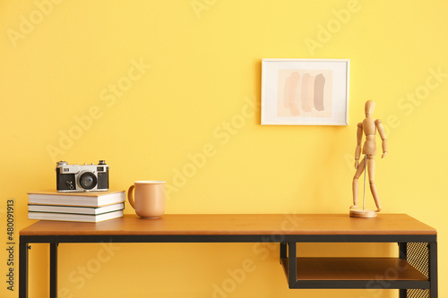 Workplace with books, cup a...