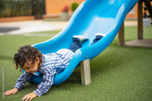 Cute little boy playing happily in the park