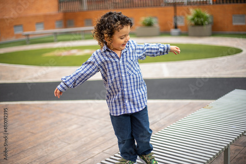 Cute little boy playing happily in the park