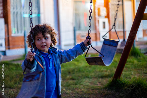 Cute little boy playing happily in the park