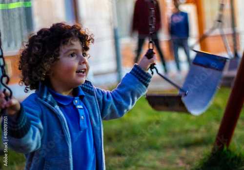 Cute little boy playing happily in the park