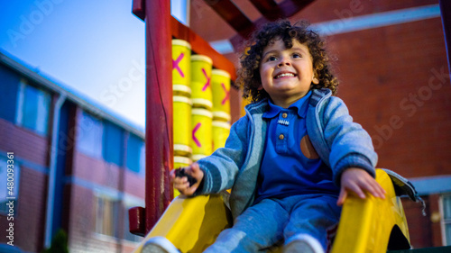 Cute little boy playing happily in the park