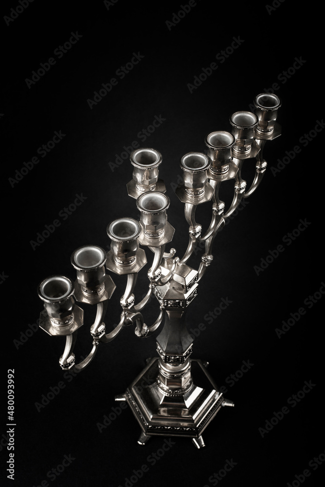 Silver Hanukkah Menorah on a black background. Silver Hanukkah Menorah on a black background.