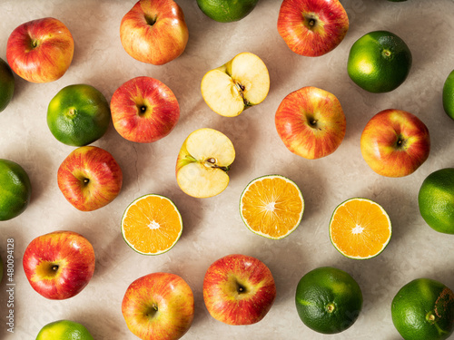 Fototapeta Naklejka Na Ścianę i Meble -  Sliced apples, tangerines and fruits 