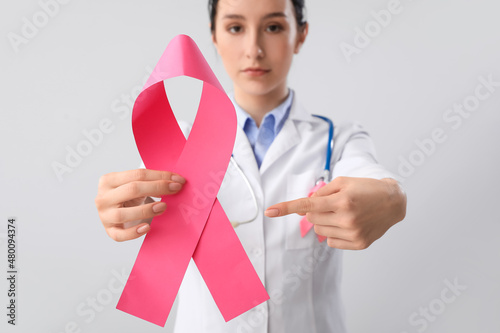 Female oncologist with pink...