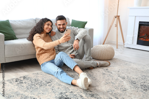 Happy young couple with  mo...