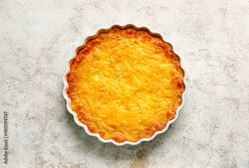 Baking dish with tasty English fish pie on light background photo