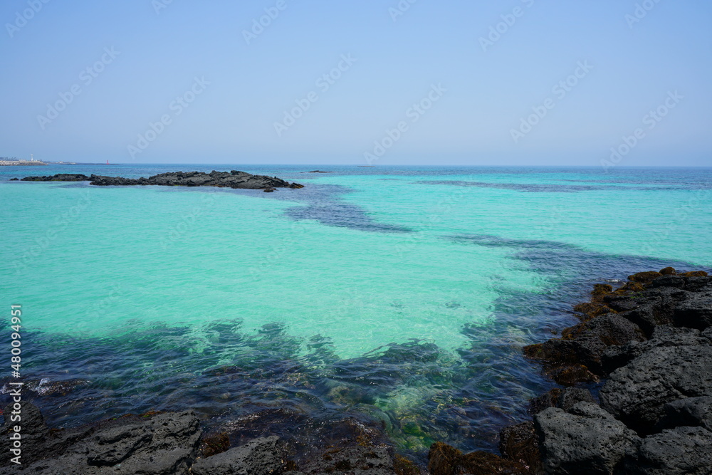 a shoaling beach with crystal-clear water