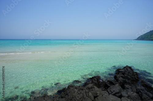 a shoaling beach with crystal-clear water