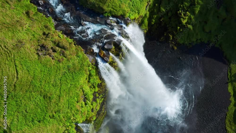 Top View Of Famous Seljalandsfoss Waterfall In Iceland With Powerful Cascade Splashing From Rocky Cliff. aerial Top View Of Famous Seljalandsfoss Waterfall In Iceland With Powerful Cascade Splashing From Rocky Cliff. aerial