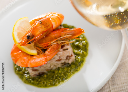 Dish of Mediterranean cuisine - baked in oven tiger shrimps on rice pillow