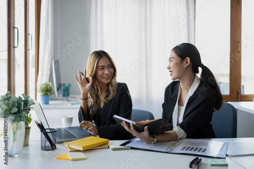 Two asian businesswoman discussing for new project planning in office.