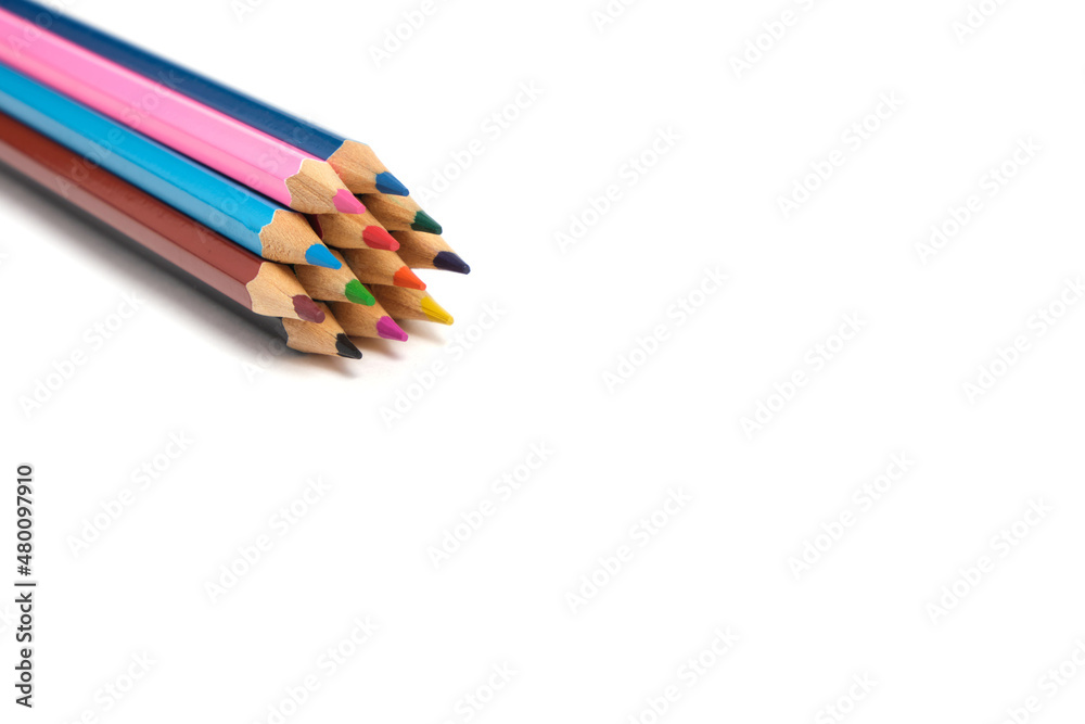 Bright colored pencils on a white background.School supplies for drawing. Bright colored pencils on a white background.School supplies for drawing.