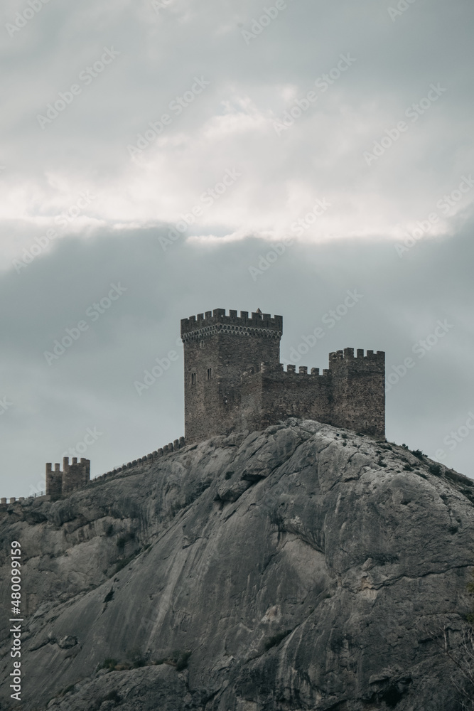 Crimea. Genoese fortress. Towers of the old fortress in the distance against the background of clouds in cloudy weather