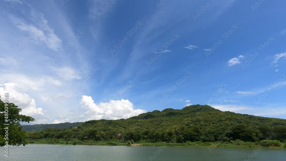 Time Lapse, River view, hills and blue clouds, very sunny weather Time Lapse, River view, hills and blue clouds, very sunny weather