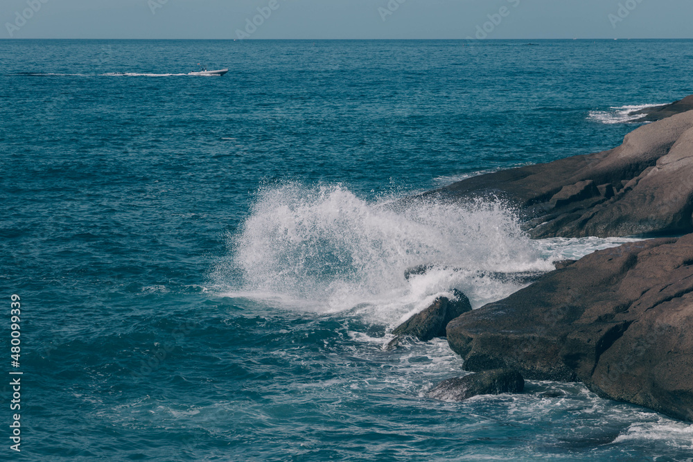 The waves of the Atlantic Ocean crash on rocks with splashes in Tenerife The waves of the Atlantic Ocean crash on rocks with splashes in Tenerife
