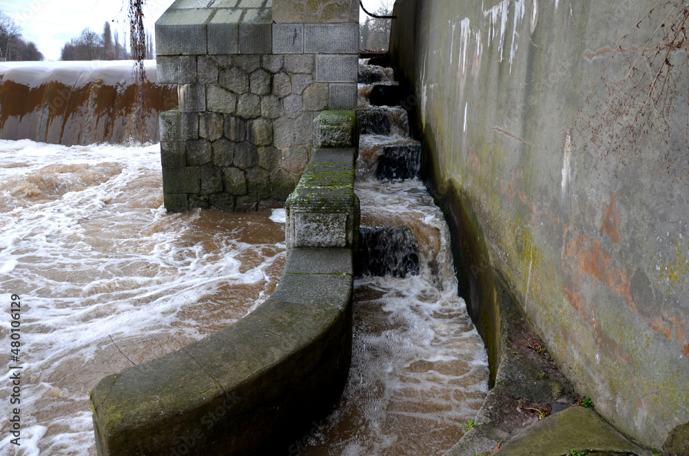 the turbid water during the flood falls from large dams and forms a lot ...