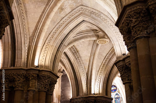 Interior pillars and masonry of a cathedral with stained glass windows