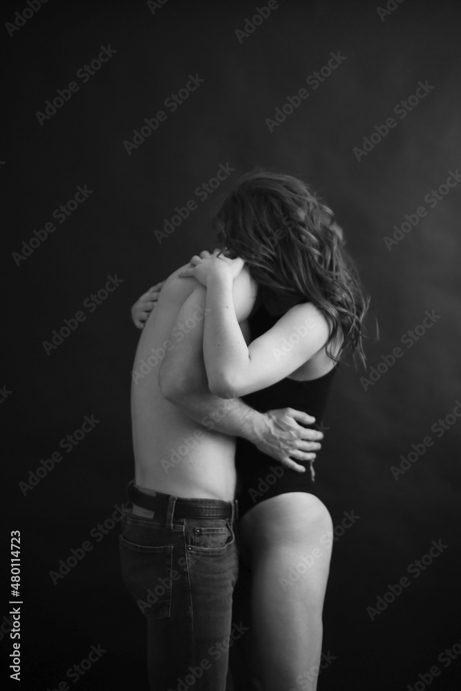 Sensual touches between a man and a woman, a beautiful fashion portrait of a couple, body details with a slight element of eroticism. A place for text and a blurred fleur of love Sensual touches between a man and a woman, a beautiful fashion portrait of a couple, body details with a slight element of eroticism. A place for text and a blurred fleur of love