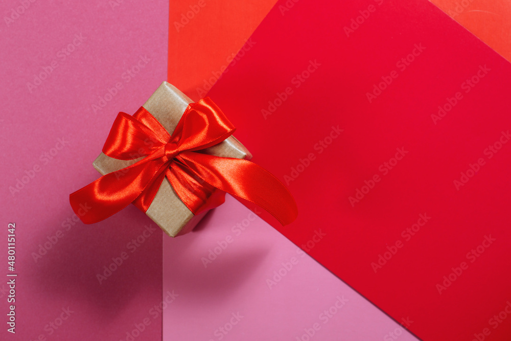 Gifts in kraft paper with red ribbon. Gifts in kraft paper with red ribbon.