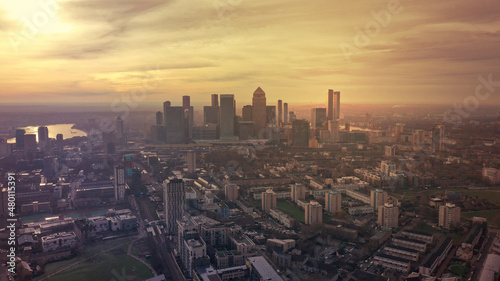 Aerial drone photo of iconic skyscraper banking and business complex of Canary Wharf at sunset  Docklands  London  United Kingdom