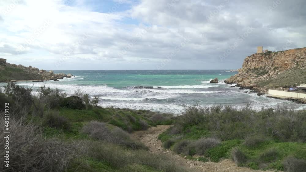 Path Leading to Ghajn Tuffieha Bay with Turquoise Colour Mediterranean Sea Raging in Winter Path Leading to Ghajn Tuffieha Bay with Turquoise Colour Mediterranean Sea Raging in Winter
